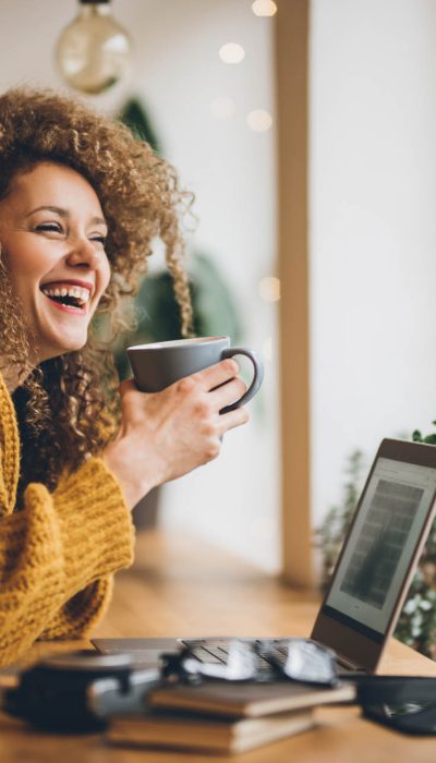 Young woman Enjoying of work and coffee